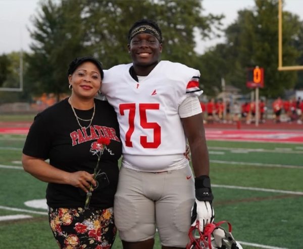 Tony poses with his mother after the opening ceremony of Palatine’s 2024-2025 football season