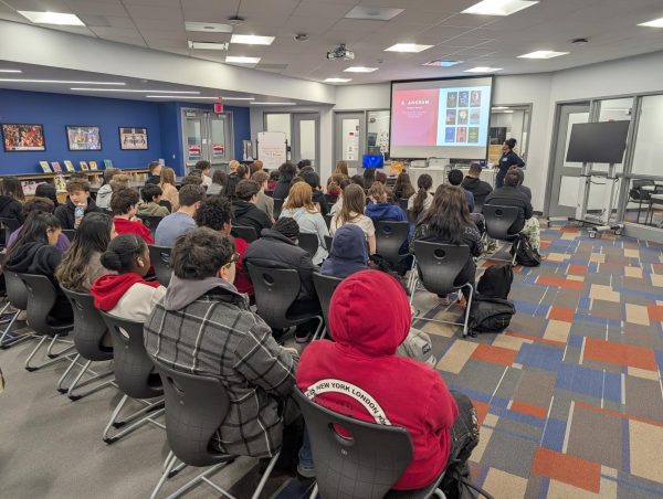 Author Kayla Ancrum leads an in-person workshop, sharing her journey and offering advice on becoming an author.