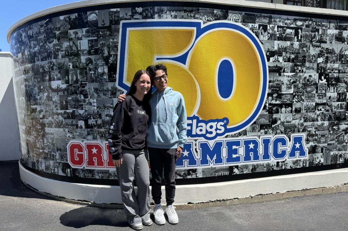 Junior Didrik Caleja and senior Jules Gawlas pose in front of a photo wall at Six Flags Great America in Gurnee to commemorate its 50th anniversary. Earlier in 2026, the park asked guests to submit their memories and photos, ranging from 1976 to present-day.